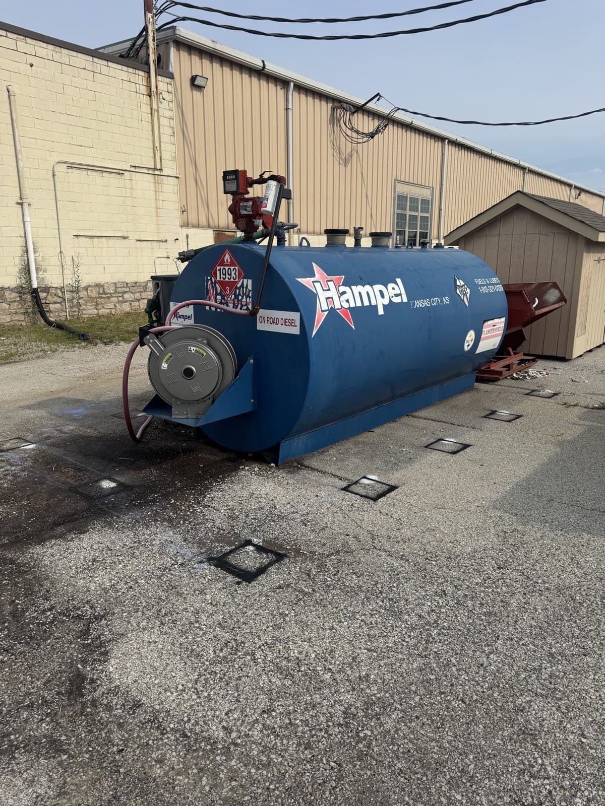 Steel safety bollards protecting a commercial diesel fuel tank