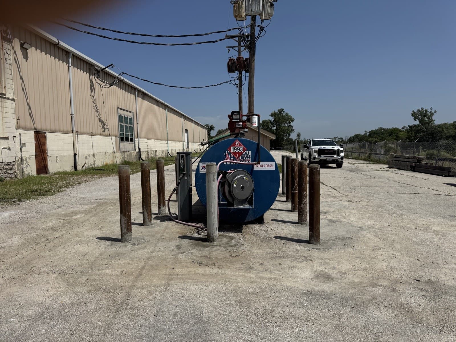 Steel safety bollards surrounding a commercial diesel tank